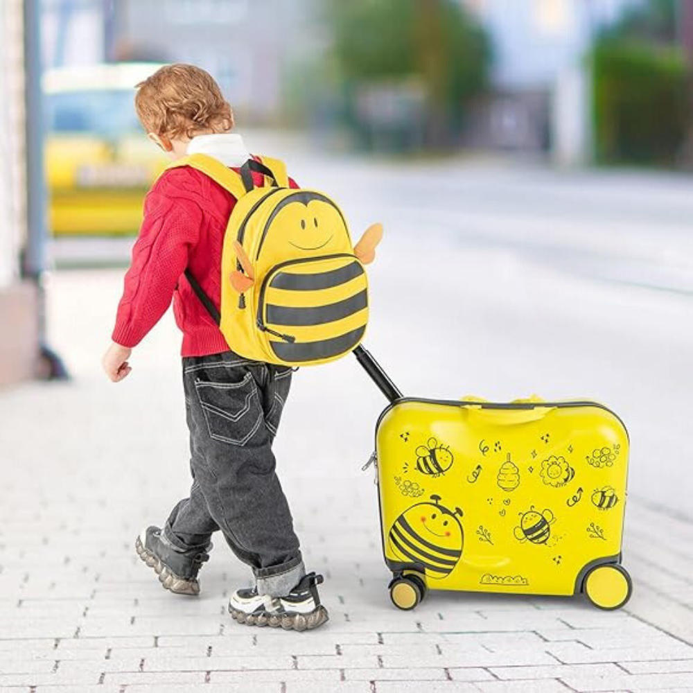 Kid Walking With His Yellow Luggage And Backpack