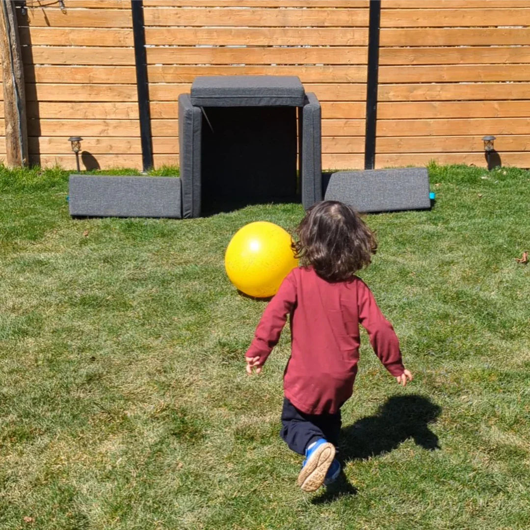 kid playing outdoors with a modular play couch