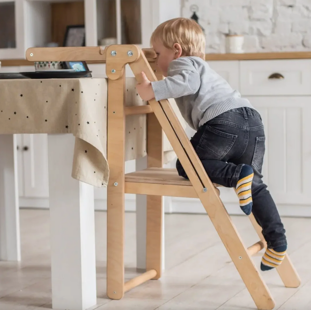 Toddler in a Montessori Kitchen Helper Tower